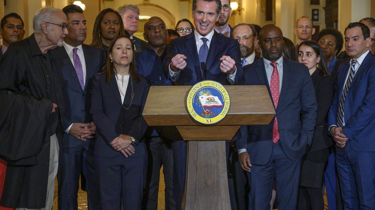 California Gov. Gavin Newsom speaks during a news conference at the State Capitol on March 13, 2019 in Sacramento. Newsom put a moratorium on the death penalty in California on Wednesday, sparing the lives of more than 700 death-row inmates. At far left is former state Senate President Pro Tem John Burton, of San Francisco. Burton’s efforts to end the death penalty while he was in the legislature were cited by Newsom as being instrumental in his decision to place a moratorium on state executions.