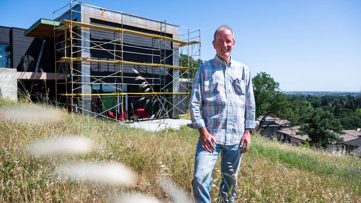 Folsom City Councilmember Mike Kozlowski stands outside his unfinished home on Friday, after leading Bee reporters through his lower-level living space.
