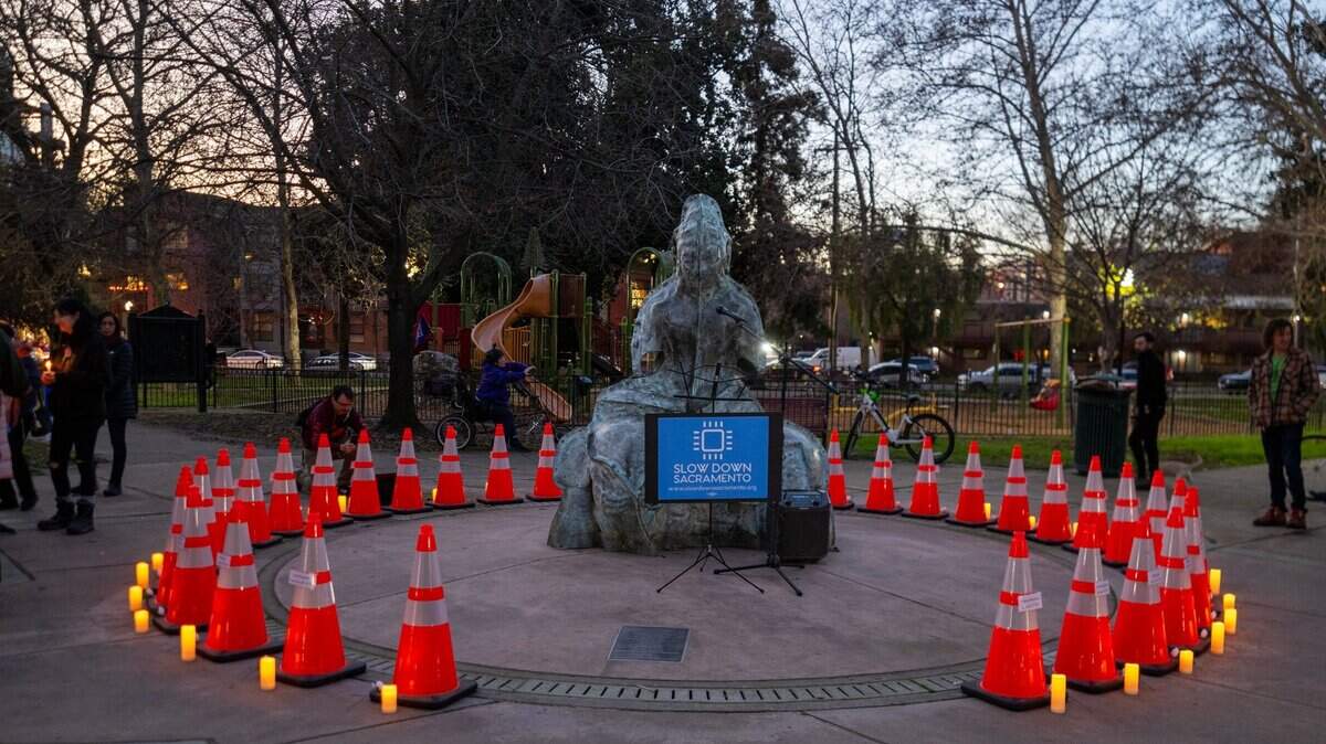 Cones form a circle in the center of Fremont Park to represent people who died in fatal traffic collisions on Sacramento streets  during a vigil hosted by Slow Down Sacramento on Thursday, Jan. 2, 2025. Of the 33 cones, 32 bore the names of a person who died in 2024. The final cone was left blank to represent those who might have been overlooked or those who might still die of injuries sustained in a crash in 2024. In 2026, at least 23 people, incuding a 9-year-old, have died in collisions on city streets.