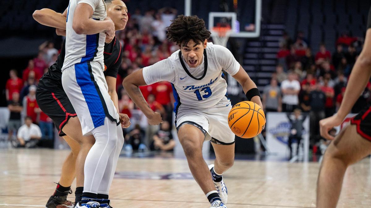 The Rocklin Thunder’s Josiah Andrews (13) drives to the basket in the second half against the Jesuit Marauders’ in the CIF Sac-Joaquin Section Division ll championship at Golden 1 Center on Thursday, Feb. 27, 2025. 