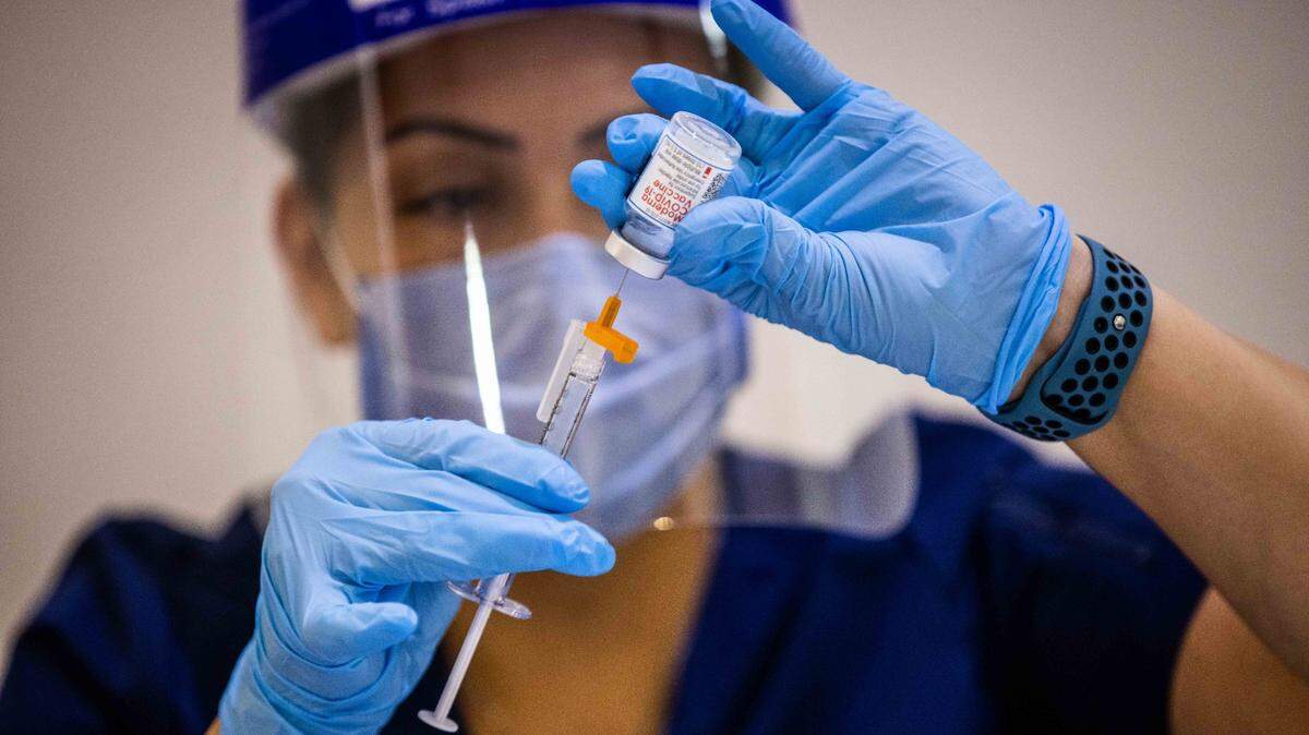 UC Davis Health nurse Alma Pelayo filled up a syringe of Moderna COVID-19 vaccine as part of the communitywide effort to prevent the spread of the respiratory disease.