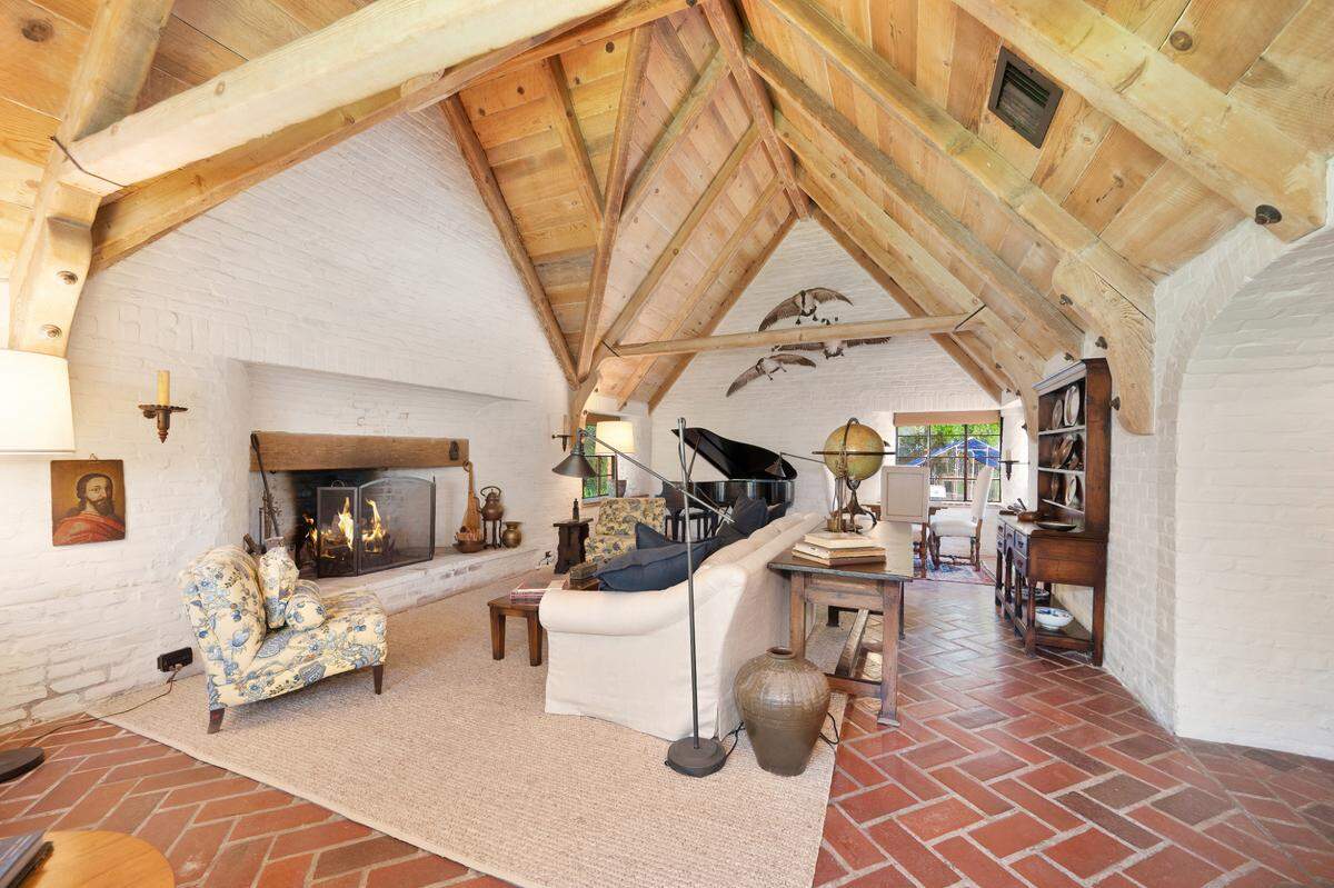 The living room with soaring timber beam ceiling.