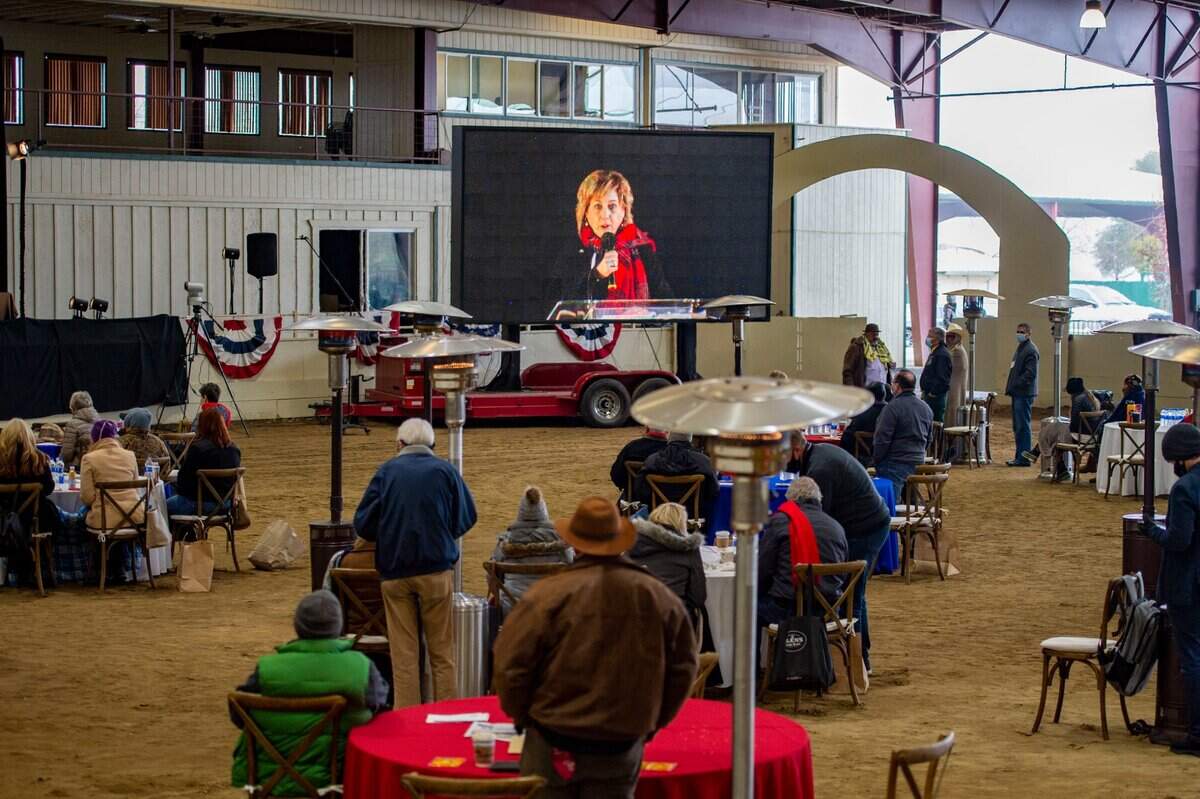 A large screen shows Sacramento County Supervisor Sue Frost as she speaks to attendees of the Re-Open Cal Now Conference at Murieta Equestrian Center in Ranch Murieta on Saturday, Jan. 9, 2021,