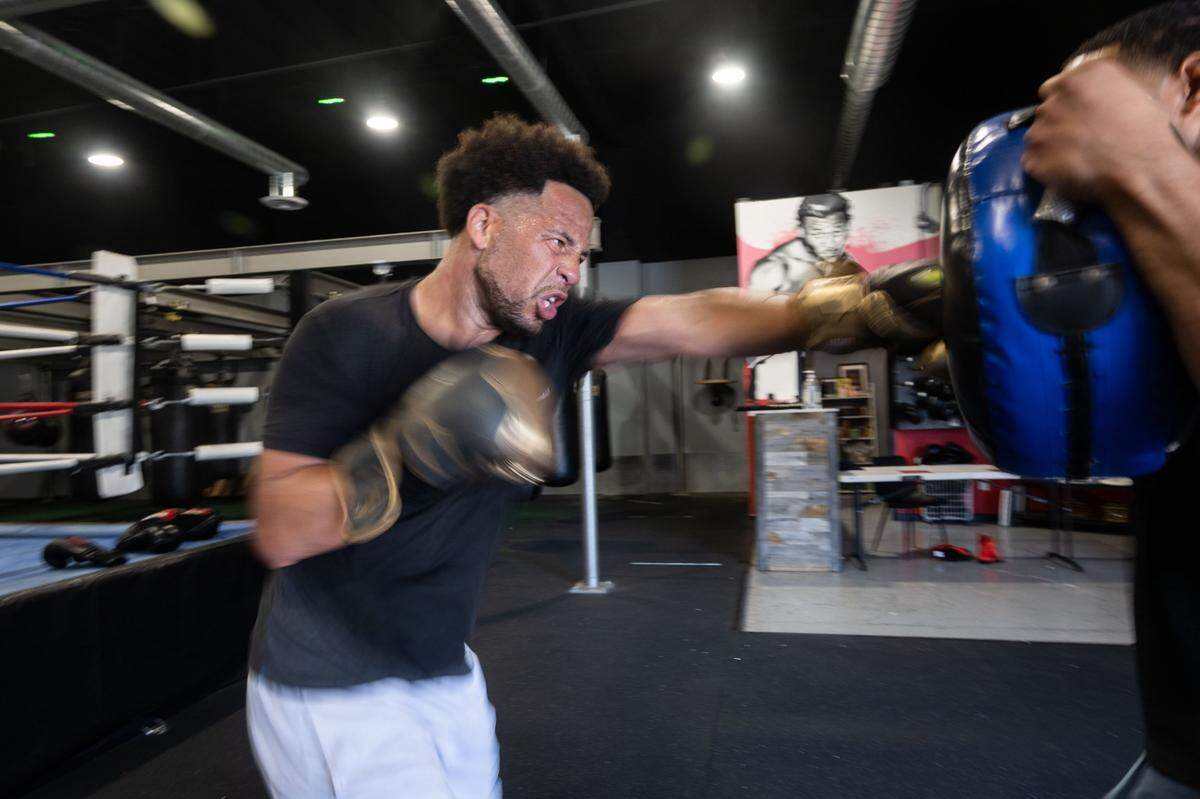 Sacramento State President Luke Wood throws some punches last month at Flawless Boxing & Fitness in Sacramento.