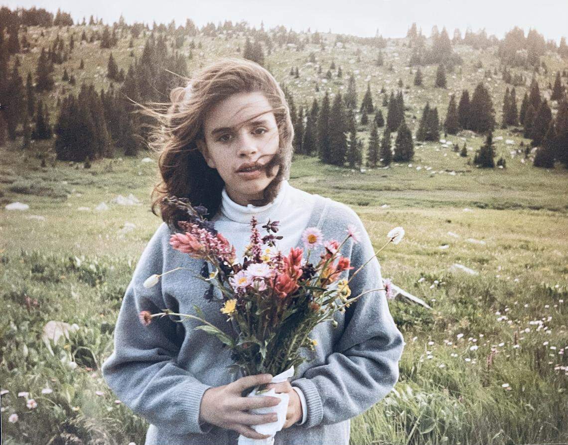 Alicia Relles loved flowers, her family said, and this photo shows her in her younger years holding a bouquet.