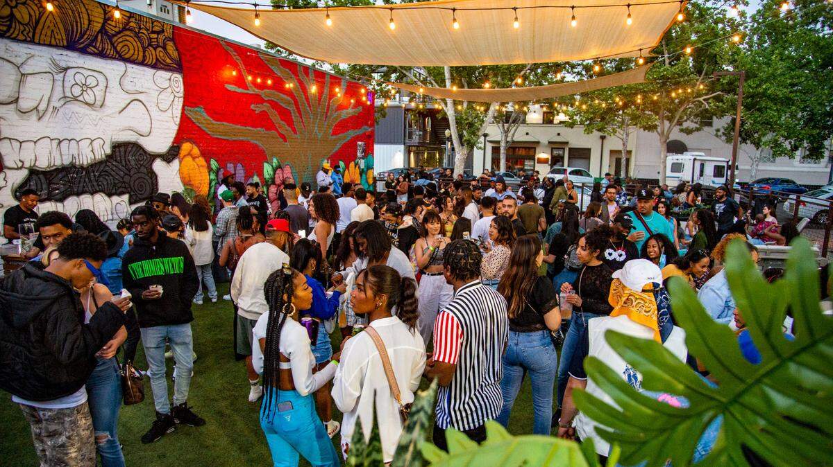 People gather at Ester Park in Oak Park for Algorhythm, a networking event and day party for professionals, artists and entrepreneurs, Saturday, May 15, 2021.