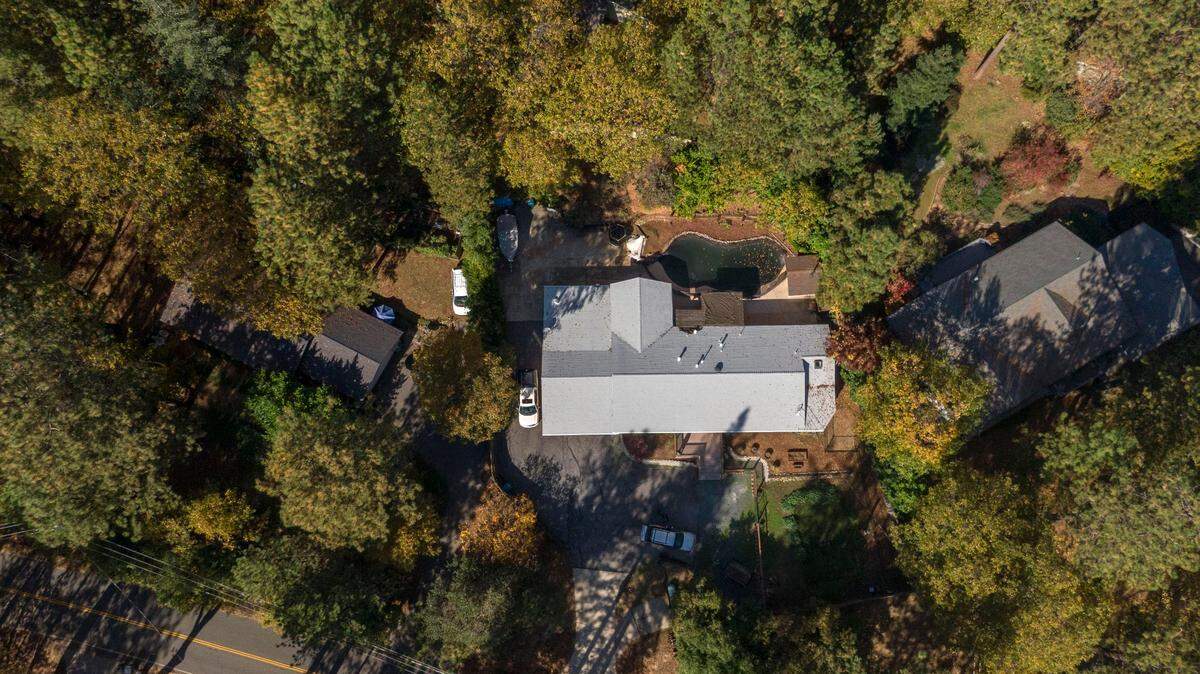 Conor Scott’s home in Alta Sierra is surrounded by oaks and manzanita. He said that money that he could have used to improve the fire safety of his home is now going to insurance.