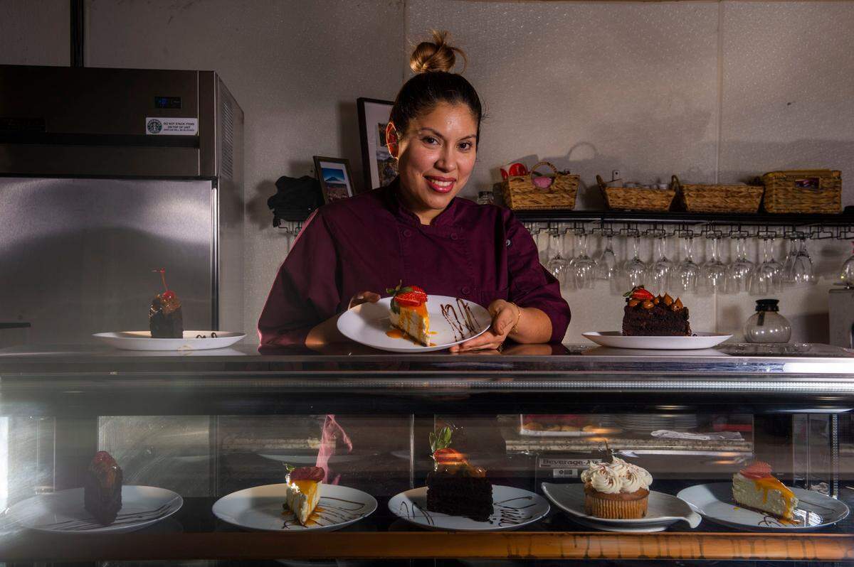 Marleny Chávez, pastry chef at Chicha Peruvian Kitchen in Roseville, holds a passion fruit cheesecake earlier this month. Chávez received her pastry training at Le Cordon Bleu in Lima, Peru.