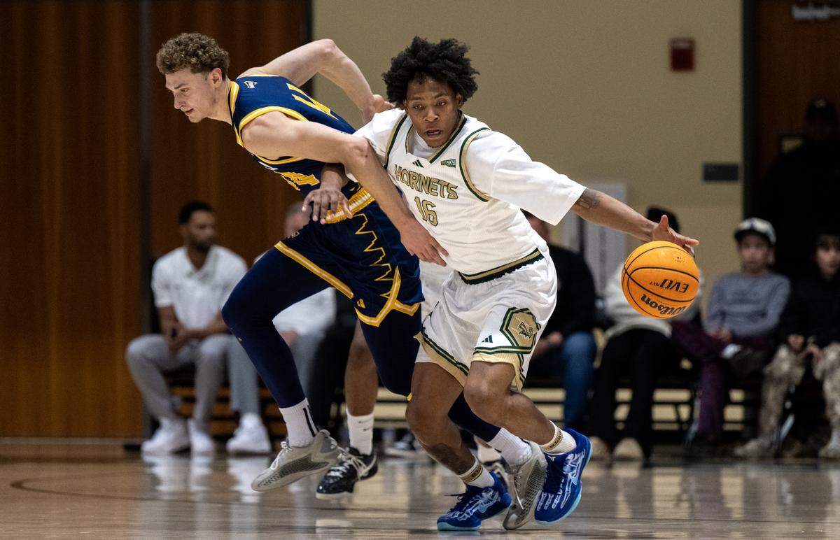 Sacramento State Hornets guard Prophet Johnson (16) picks up a loose ball ahead of Northern Arizona Lumberjacks guard Arne Osojnik (44) in the first half on Thursday, Jan. 15, 2026, in Sacramento.