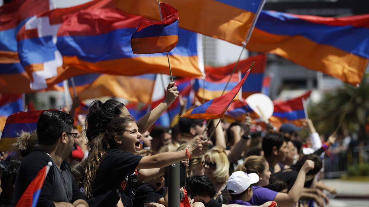 People chant their slogans outside the Turkish Consulate in Los Angeles on April 24, 2017, to protest the deaths of an estimated 1.5 million Armenians under the Ottoman Empire.