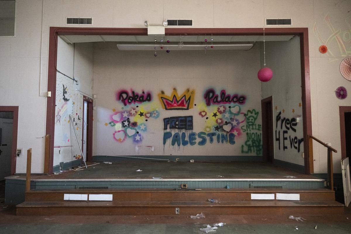 Graffiti marks the walls of the theater inside the Old North Sacramento School earlier this month. 