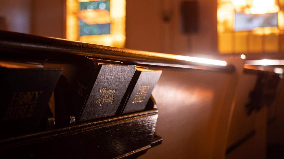 Church pews with hymns and bible. 