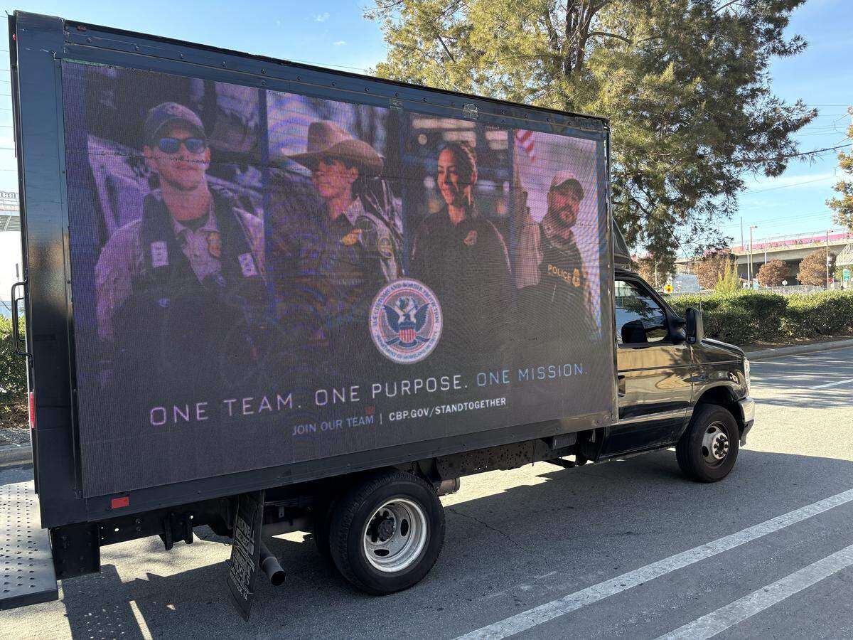 A van advertising recruitment for U.S. Customs and Border Enforcement is seen Sunday on Lafayette Street in Santa Clara near Levi’s Stadium where Super Bowl LX took place.