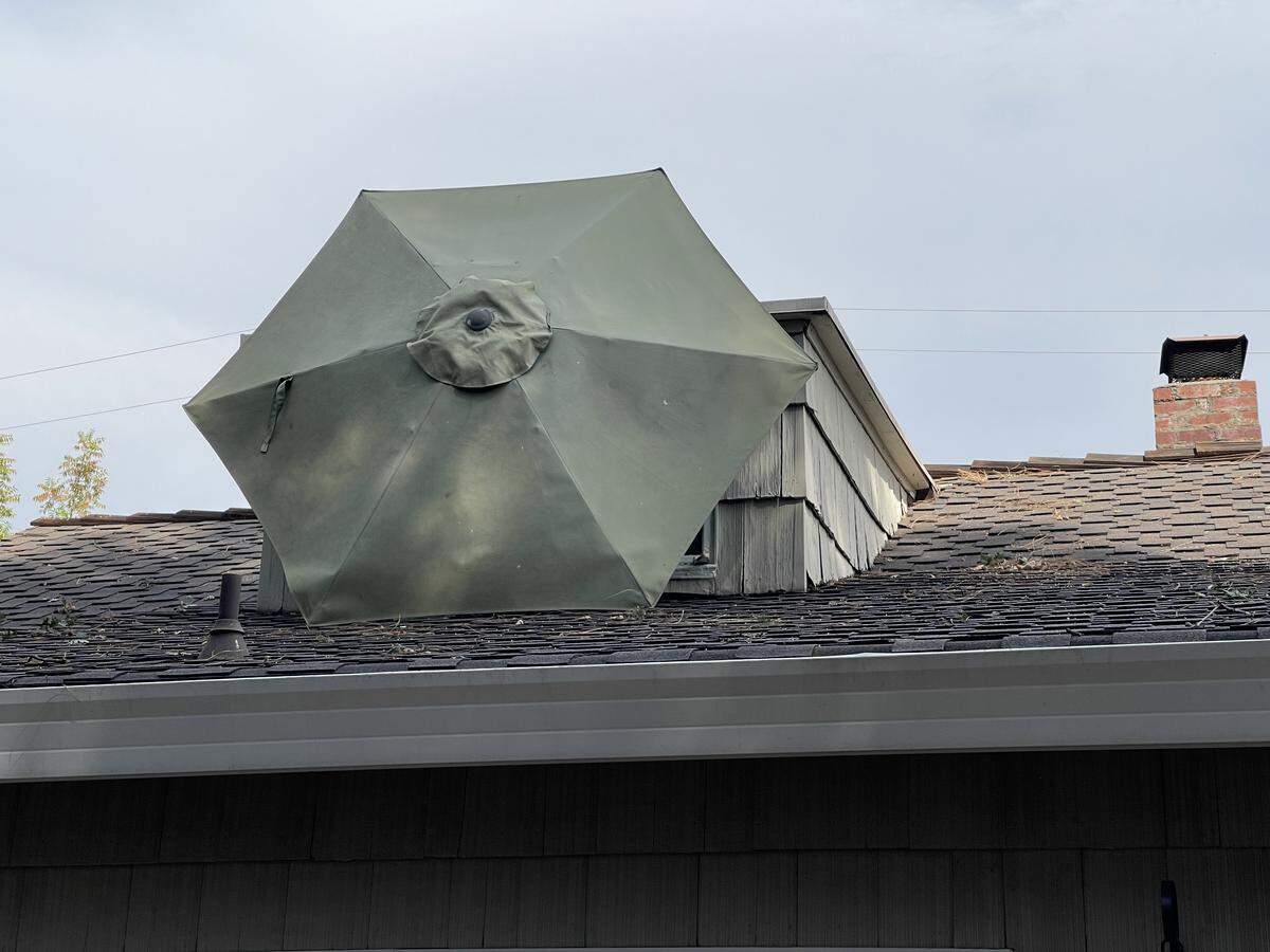 Winds gusts in Citrus Heights sent an umbrella from the backyard of Candy O’Neil into a second-story dormer window at her home on Tuesday.