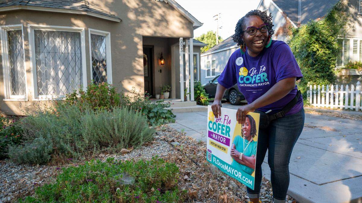 Flo Cofer puts up a yard during her 2024 campaign for mayor of Sacramento. Cofer in 2026 is running for the Sacramento County Board of Supervisors