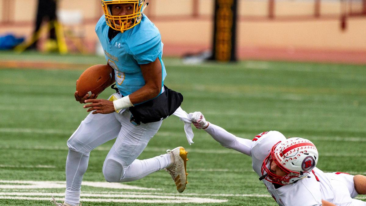Ripon Indians Austin Bonilla (20) attempts to tackle Center High School Cougars Michael Wortham (6) during the first quarter as the Center High School Cougars host the Ripon Indians in the Sac-Joaquin Section Division V final at Hughes Stadium in Sacramento, Saturday, Nov. 30, 2019.