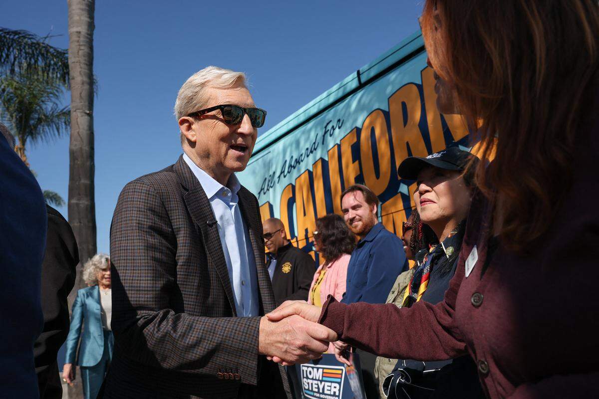 Democratic candidate Tom Steyer shakes hands with supporters during a campaign event ahead of the California Gubernatorial Primary election at Pan Pacific Park in Los Angeles, California on May 7, 2026. (Photo by Patrick T. Fallon / AFP via Getty Images)