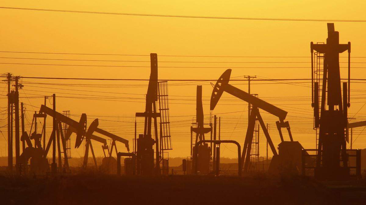 Pump jacks are seen at dawn in an oil field over the Monterey Shale formation near Lost Hills, California. 