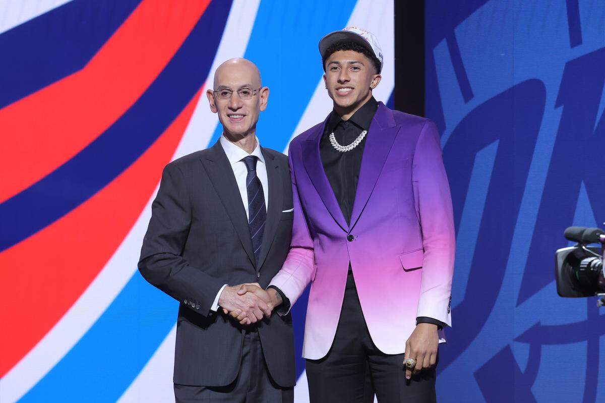 Nique Clifford stands with NBA commissioner Adam Silver after being selected by the Oklahoma City Thunder as the 24th pick and traded to the Sacramento Kings during the 2025 NBA draft on Wednesday at Barclays Center in Brooklyn, New York.