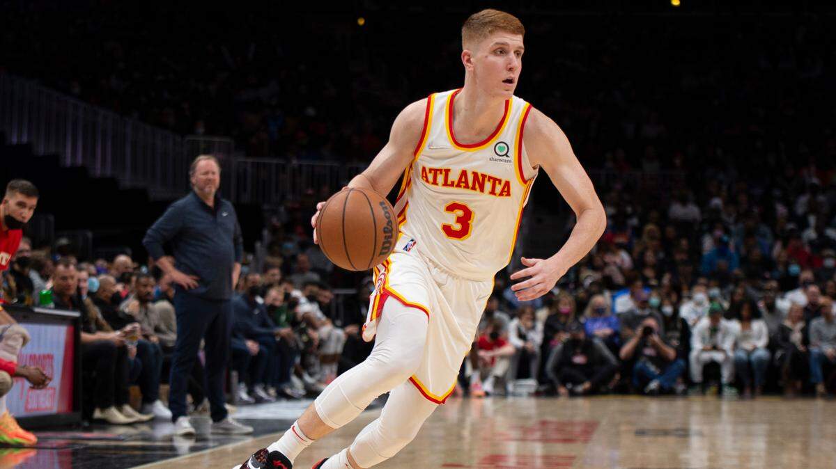 Atlanta Hawks Kevin Huerter (3) dribbles during the second half of an NBA basketball game against the Milwaukee Bucks on Sunday, Nov. 14, 2021, in Atlanta. (AP Photo/Hakim Wright Sr.)