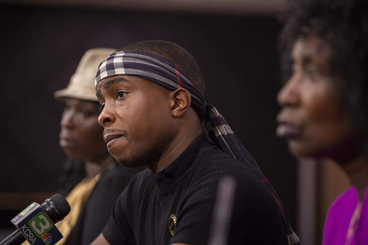 Stevante Clark with his mother Sequette Clark, left, and grandmother Sequita Thompson meet the media after the Sacramento Police Department cleared officers Terrence Mercadal and Jared Robin in the 2018 shooting death of Stephon Clark, at Bayside Church in Sacramento on Thursday, Sept. 26, 2019.