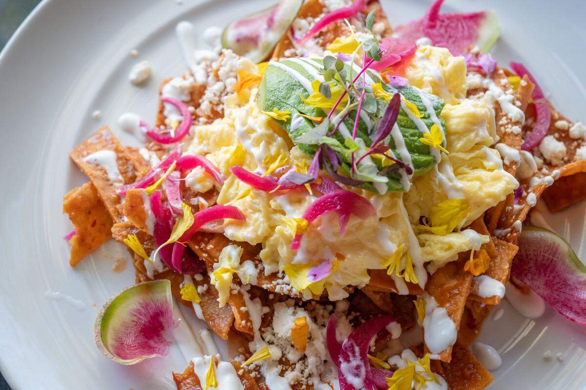 The chilaquiles at Juan Barajas’ Savory Cafe in Woodland are made of corn tortilla strips, salsa roja, local eggs topped with feta, avocado, pickled onion, sour cream and micro cilantro.