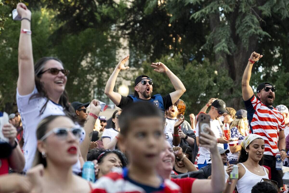 Team USA fans cheer as the United States saves a goal during a World Cup game against Turkey on Thursday. Fans gathered to watch the World Cup game at a block party hosted by Republic FC in the plaza across from City Hall in Sacramento.