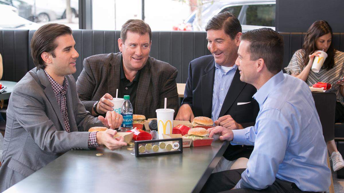 McDonalds CEO Steve Easterbrook celebrates the 50th anniversary of the Big Mac with the MacCoin and the family members of the late inventor, Jim Delligatti, on Thursday, July 26, 2018 in Chicago. (Peter Wynn Thompson/AP Images for McDonald’s)