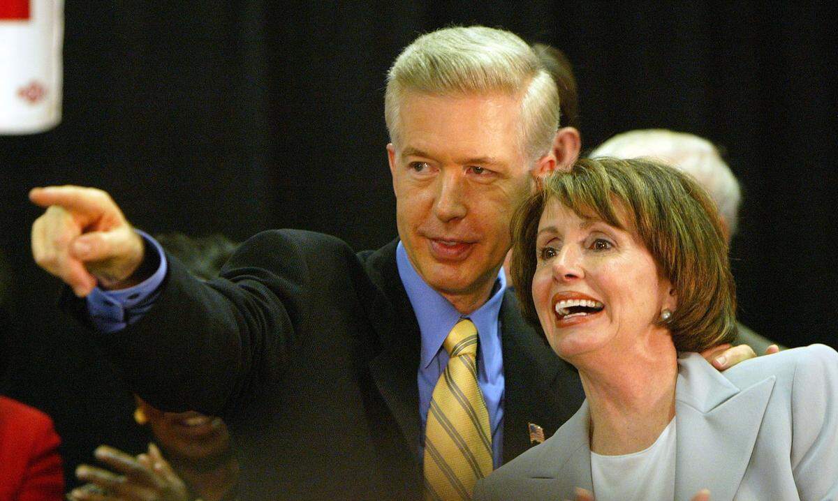 California Gov. Gray Davis points out a person in the crowd to U.S. Rep. Nancy Pelosi, D-Calif., during a rally against his recall on July 19, 2003 in San Francisco. 