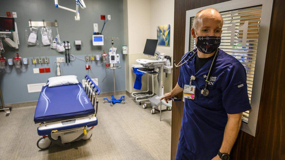Keegan Kirby, the clinical manager of the emergency department at Sutter Roseville, opens the door to the emerging infectious disease isolation room on Sunday, April 26, 2020. The room can be used for patients with infectious diseases such as COVID-19.