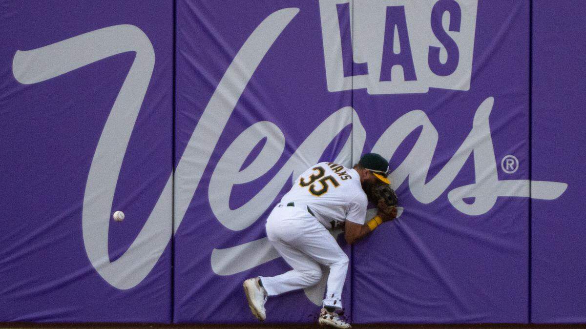 Athletics outfielder Drew Avans (35) misses a fly ball to left field hit by Minnesota Twins outfielder Byron Buxton (25) scoring 2-runs in the second inning on Athletics pitcher Luis Severino (40) during a game at Sutter Health Park on Monday in West Sacramento.
