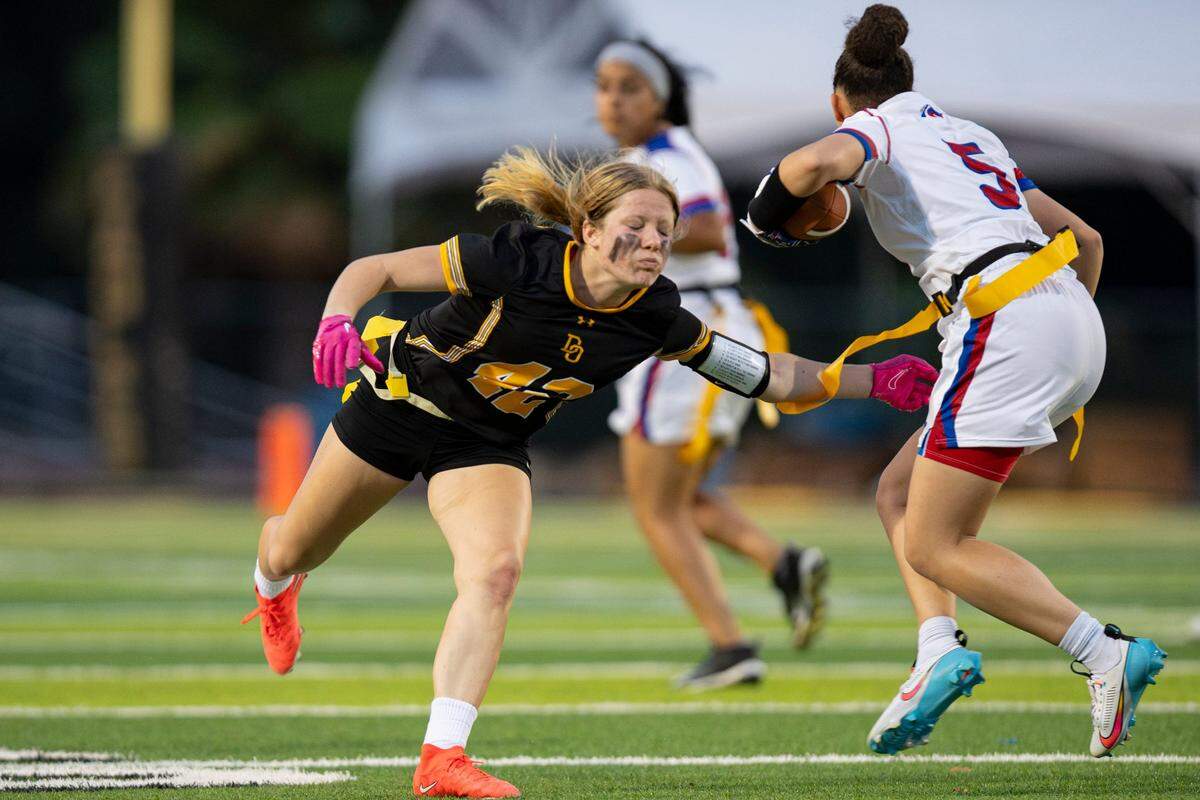 The Christian Brothers Falcons’ Aleyah Harmon (5) jukes the Del Oro Golden Eagles Cali Boehrer (42) during the second half at Del Oro High School on Monday, Aug. 21, 2023, in Loomis.