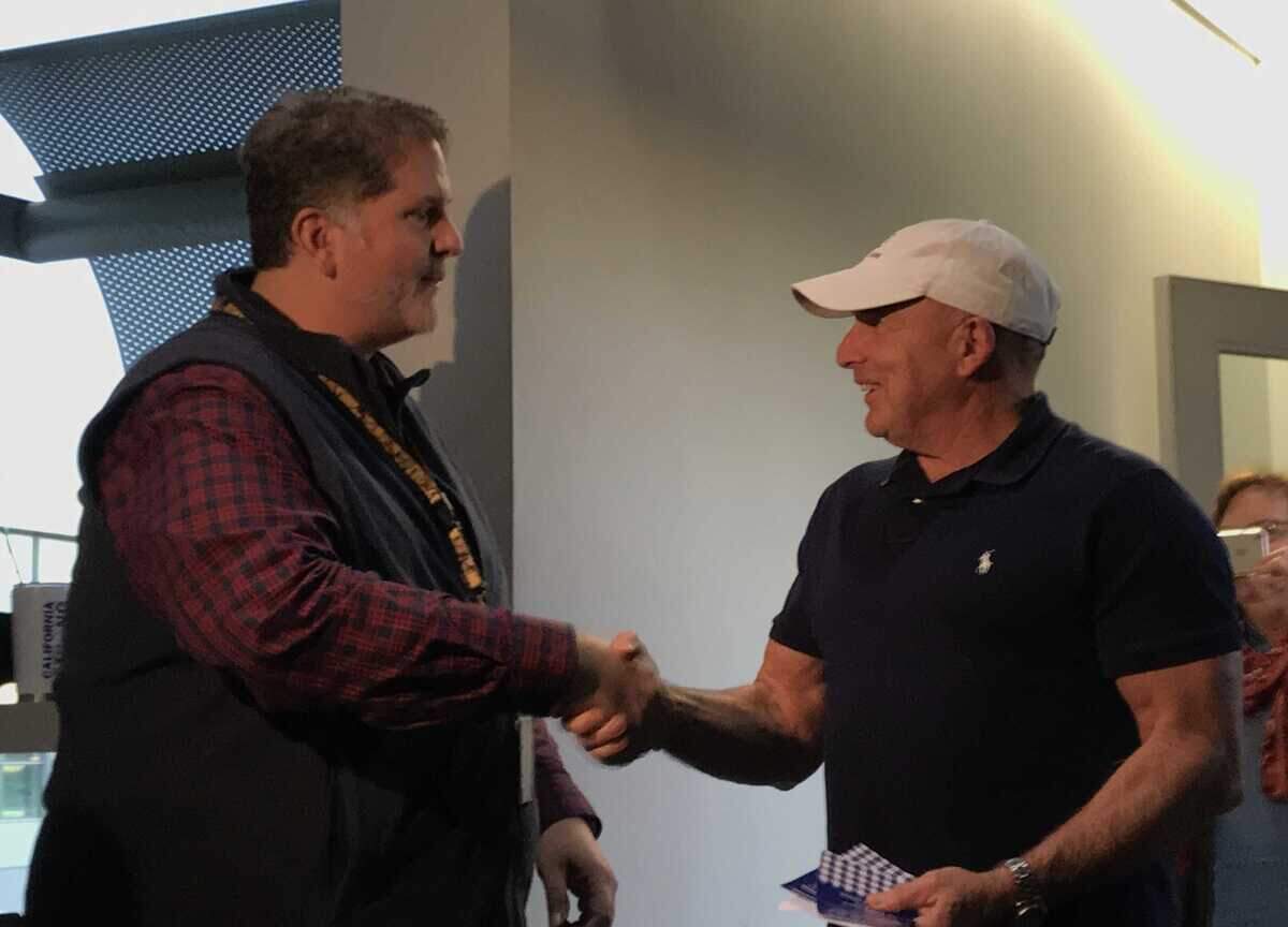 Mark Haneke, air service development manager for Sacramento International Airport (left) shakes hands with the airportâs 12 millionth flier of 2018, Gary Smith. Smith was given free Southwest rewards points and free parking, as well as a gift basket of local goodies.