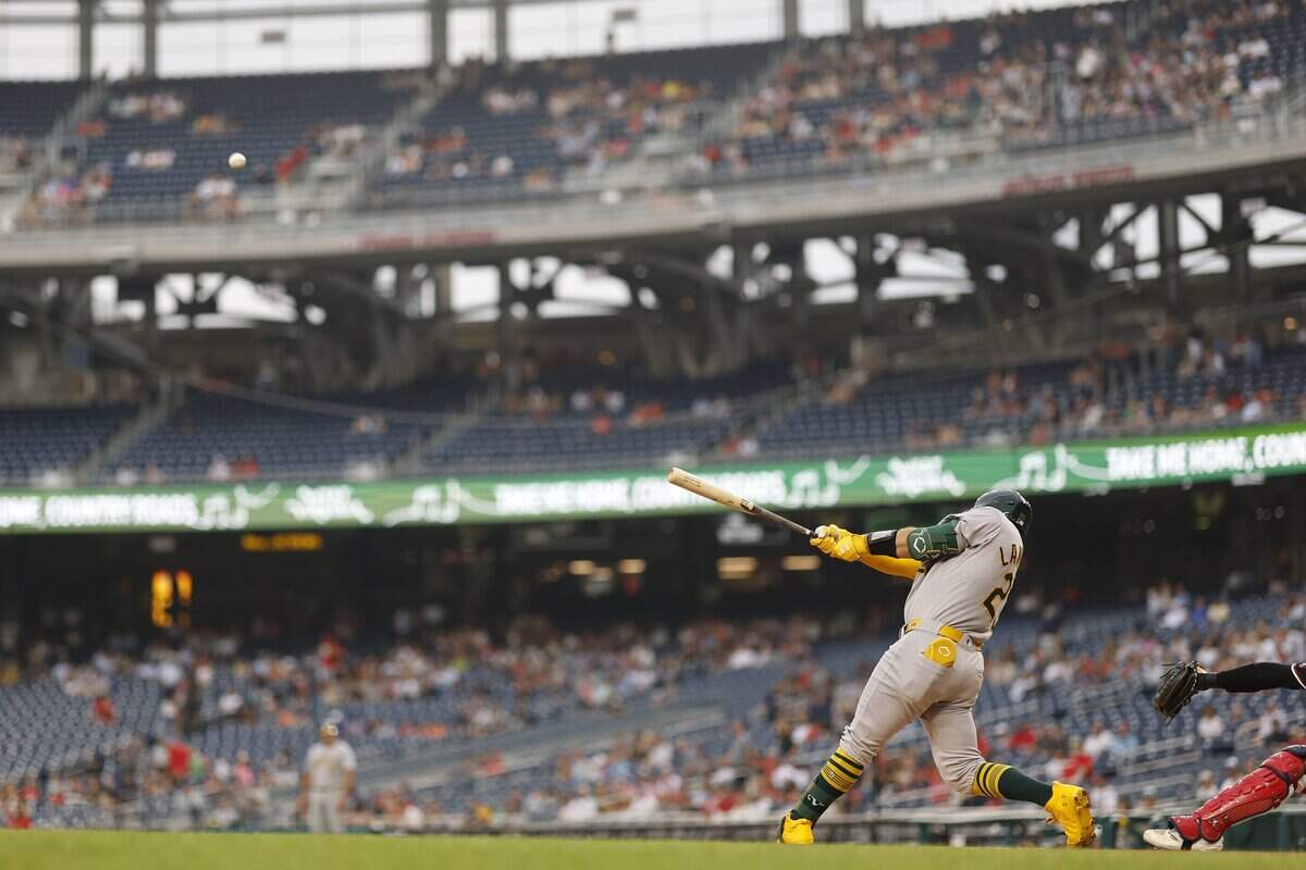 Athletics catcher Shea Langeliers (23) hits a leadoff home run against the Washington Nationals during the first inning Tuesday at Nationals Park in Washington, D.C.