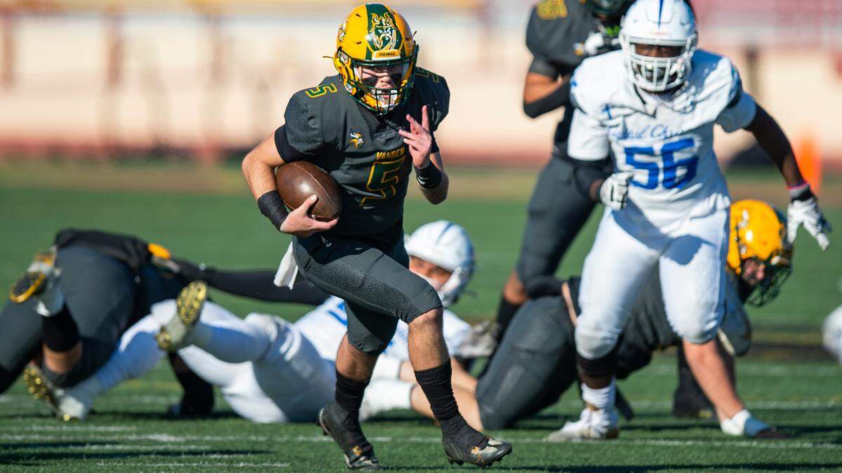 Vanden Vikings quarterback Tre Dimes scrambles downfield in the second quarter of the CIF Sac-Joaquin Section Division IV championship football game at Hughes Stadium in Sacramento on Saturday.
