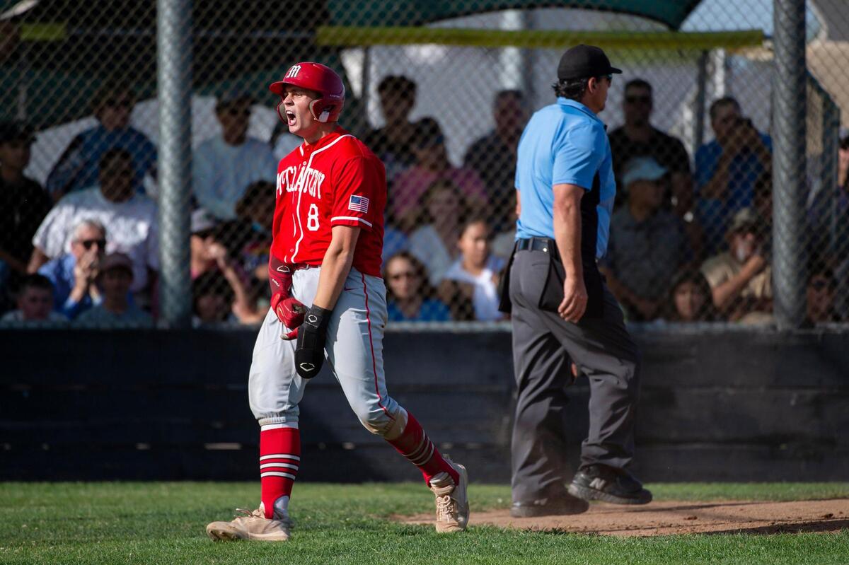 McClatchy Lions catcher Malcolm Moore (8) celebrates after scoring on an error thrown to third base in the top of the fifth inning during the Sac-Joaquin Section Division I playoff best-of-three opener Monday at Franklin High School in Elk Grove. McClatchy won 2-0.