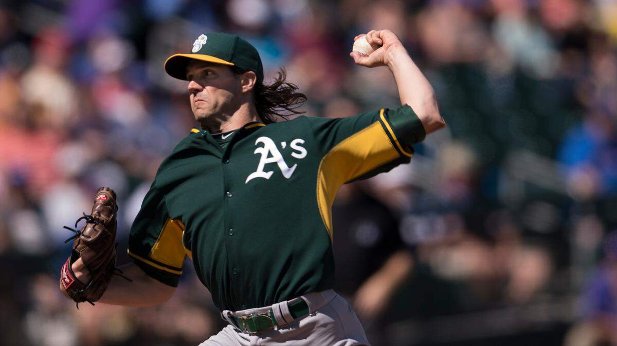 Then-Oakland Athletics starting pitcher Barry Zito pitches in the bottom of the first inning on Thursday, March 5, 2015 during the Cactus League game between the Chicago Cubs and Athletics at Sloan Park, in Mesa, Arizona. Zito along with Tim Hudson and Mark Mulder will join the team Hall of Fame in 2025.