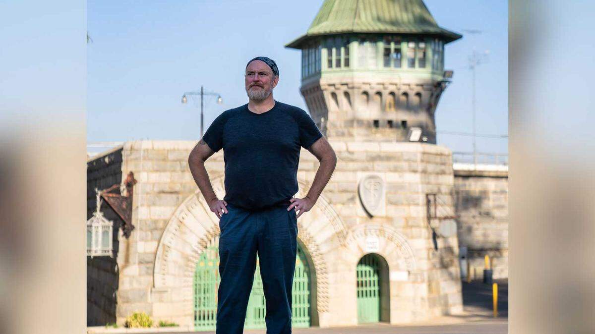 John Carter Cash, son of Johnny Cash, stands outside the gates of Folsom State Prison on Friday, Oct. 21, 2022. He will perform at the Folsom Americana Fest this weekend.