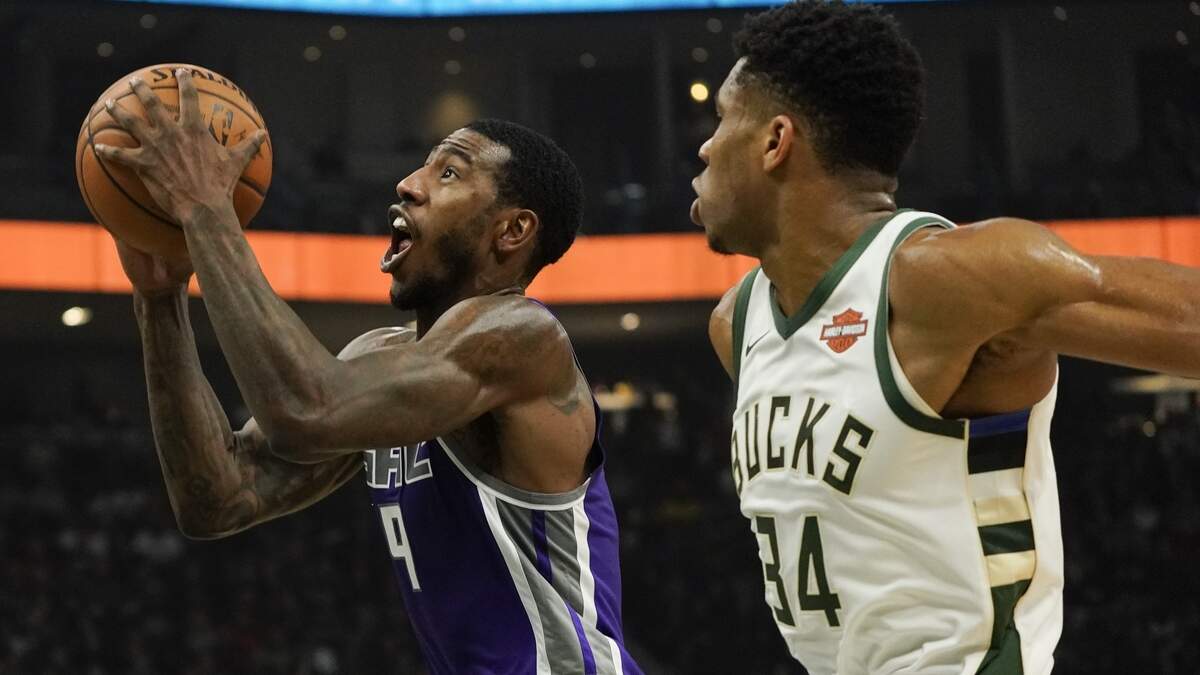Kings’ Iman Shumpert drives past Milwaukee Bucks’ Giannis Antetokounmpo during the first half of an NBA basketball game Sunday, Nov. 4, 2018, in Milwaukee. Sacramento lost 144-109.