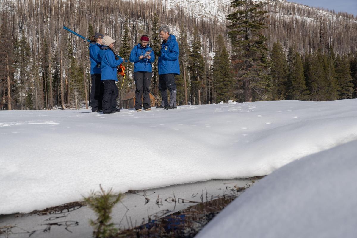 Andy Reising, manager of the snow Surveys and Water Supply Forecasting Unit for the Department of Water Resources gives his team data from the first snow survey of the year by the Department of Water Resources on Thursday, Jan. 2, 2022 at Phillips Station.