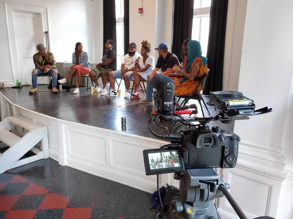 Brewers talk on stage during interviews for “One Pint at a Time,” a documentary by Florida filmmaker Aaron Hosé that follows the lives of three Black craft beer makers and the challenges of gaining a foothold in an industry where fewer than 1% of brewers are African American.