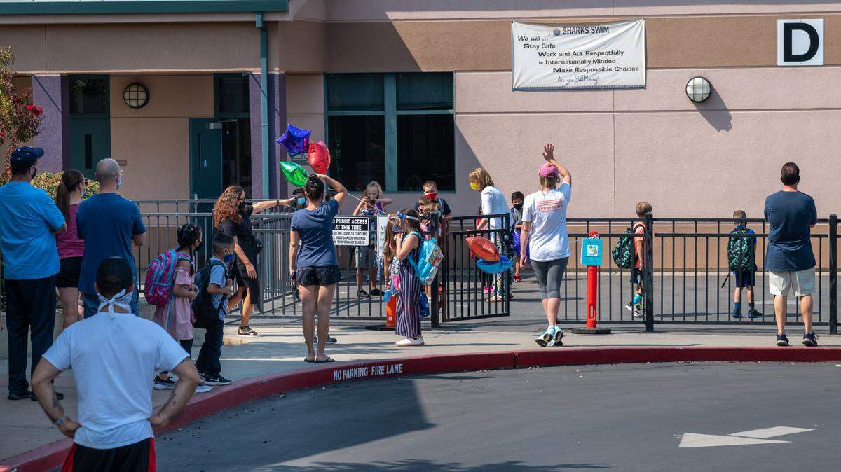 Parents pick up their children after the first day of in-class instruction day at Sierra Elementary School on Monday, Sept. 21, 2020 in Rocklin. The Rocklin Unified School District saw a 6.1% decline in enrollment this school year.