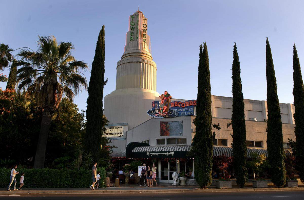 The neon sign that once marked the drugstore where Tower Records founder Russ Solomon first started selling music adorns the Tower Theatre in 2010.