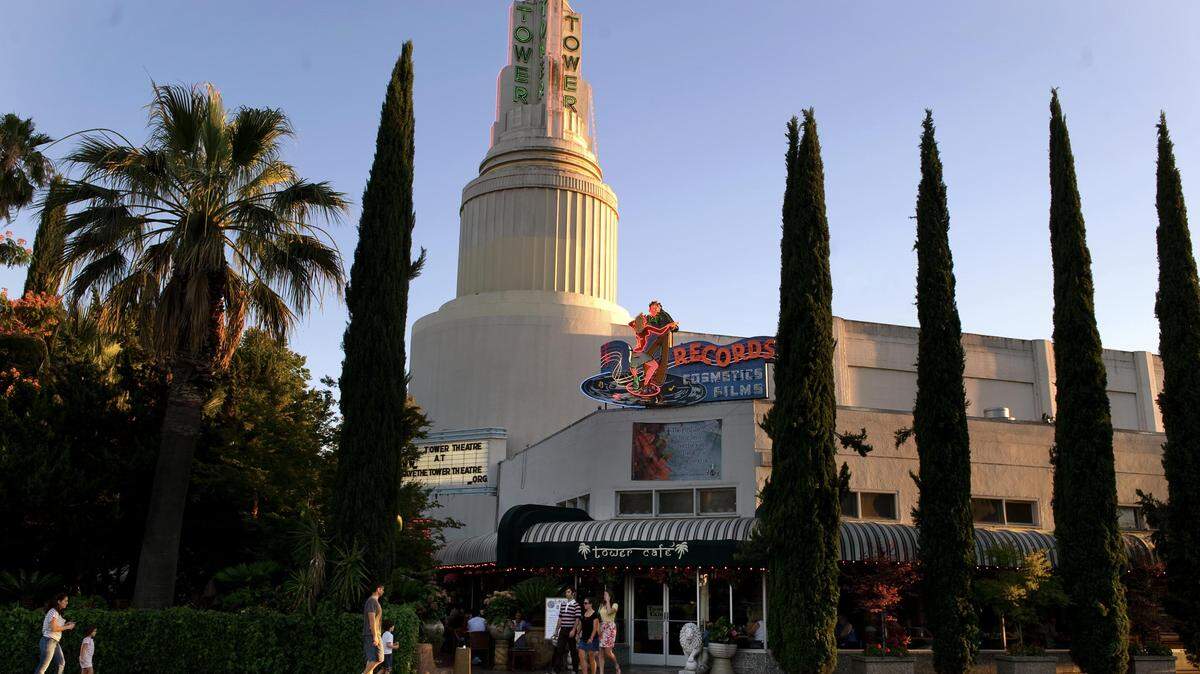 The neon sign that once marked drug store where Tower Records founder Russ Solomon first started selling music adorns the Tower Theatre in 2010.