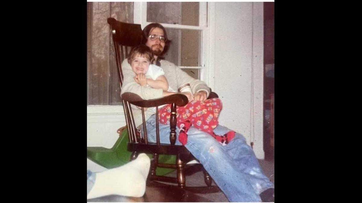William Suttle cradles his niece Karen Maloney Fitzgerald in this undated photo. Suttle was shot and killed at O’Neil Park in Sacramento’s Land Park and found Jan. 17, 1980. Suttle’s body was not identified for 44 years. His family is seeking help to find Suttle’s killer.