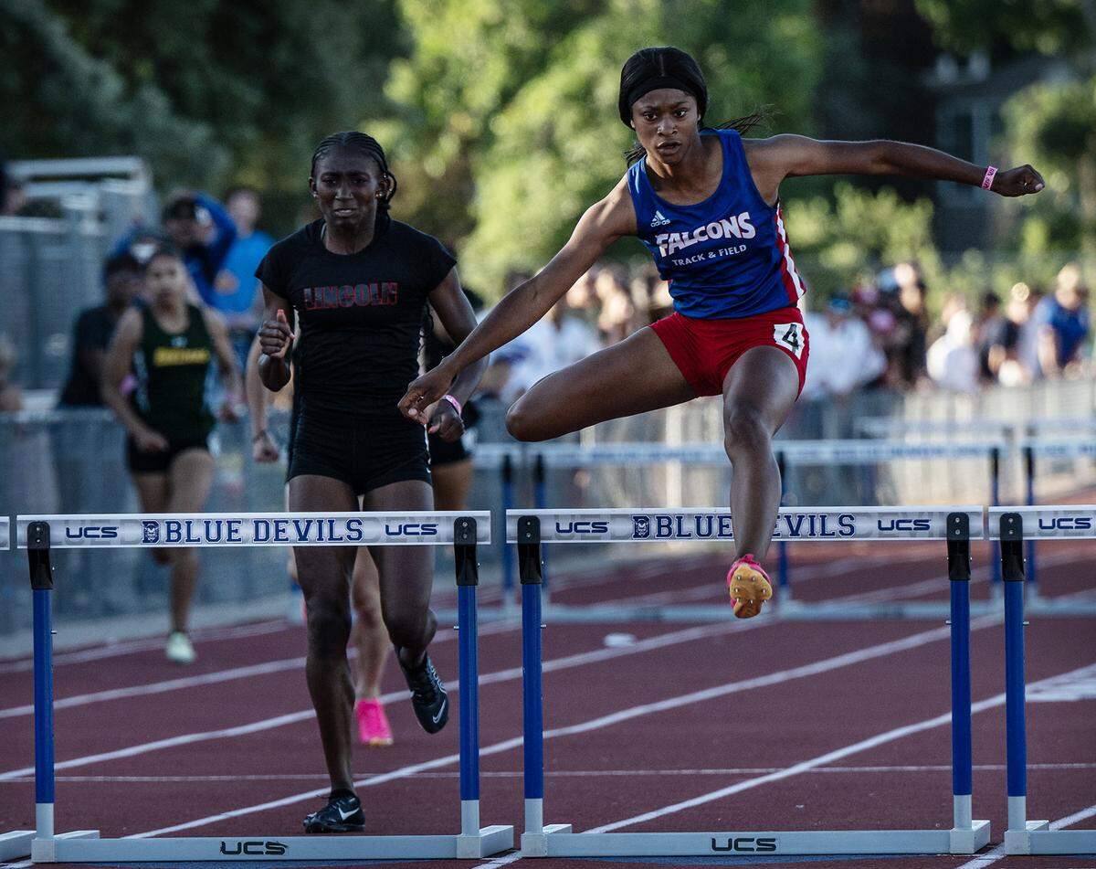 Keilee Hall of Christian Brothers, right, won the 300 meter girls hurdles with a time of 42.02, holding off Yvette Harris of Lincoln of Stockton (42.74), left, in the CIF Sac-Joaquin Section Masters track finals at Davis High School in Davis, Calif., Saturday, May 20, 2023.