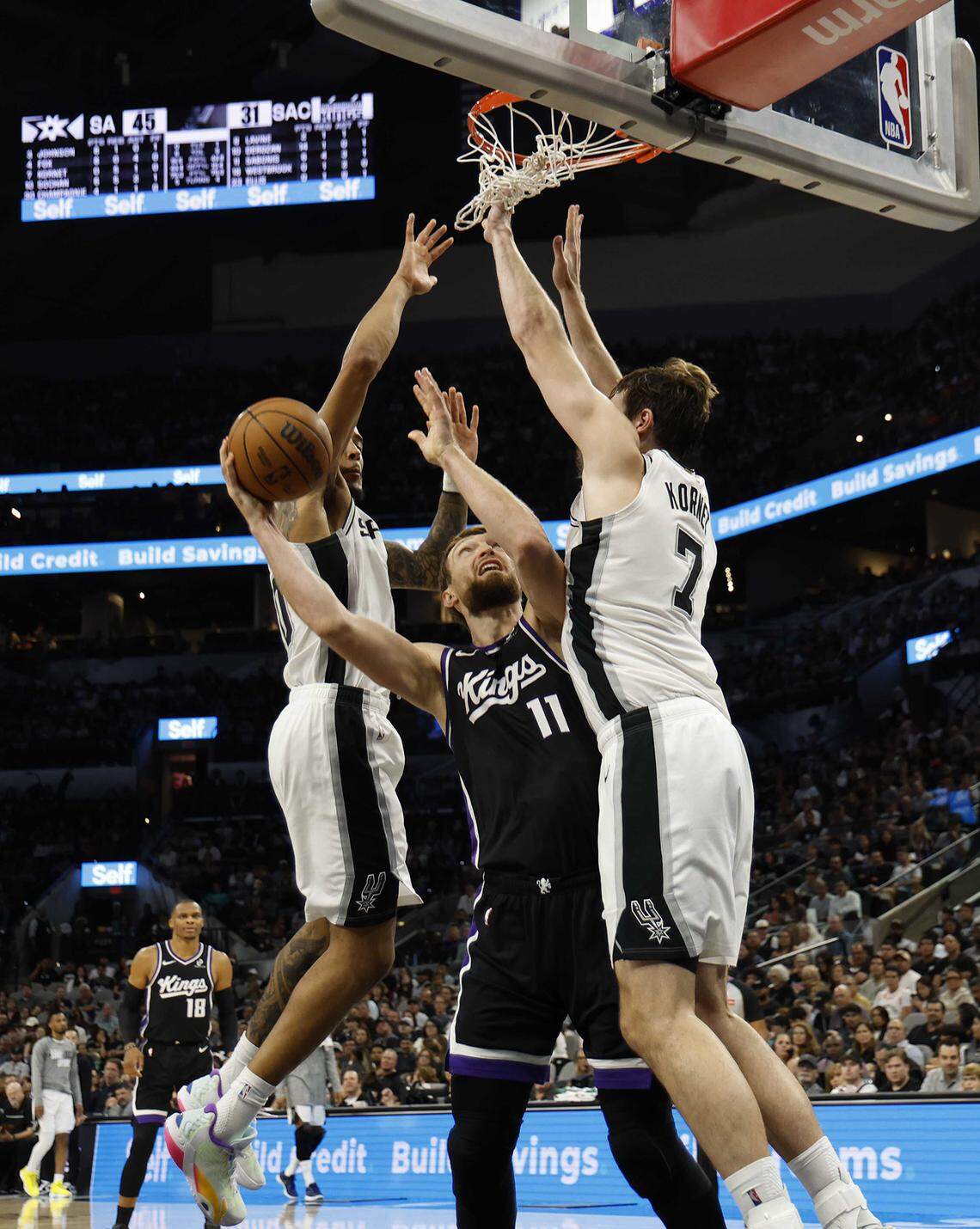 The Kings' Domantas Sabonis shoots against the Spurs during the first half Sunday in San Antonio. The Kings lost their sixth consecutive game.