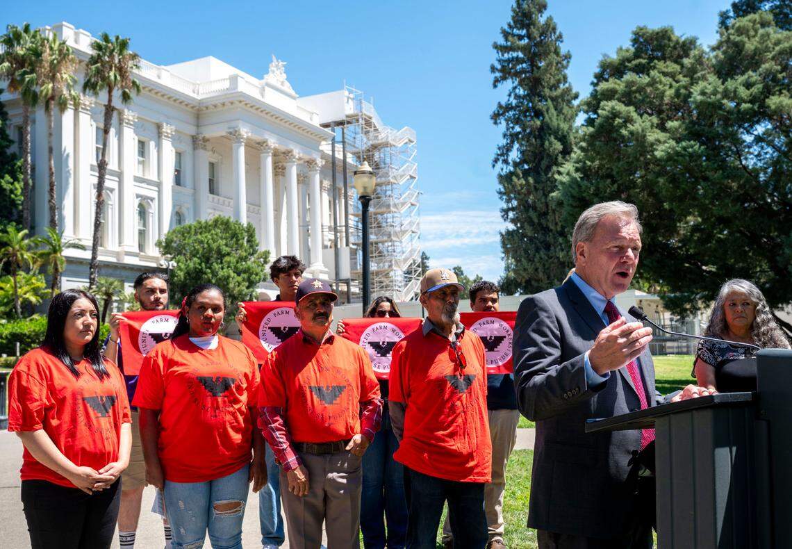 Sen. Dave Cortese, D-San Jose, speaks at a press conference outside the Capitol on Monday for Senate Bill 1299, that would make workers’ compensation claims for farmworkers presumed work-related when agricultural employers are not complying with heat safety standards.