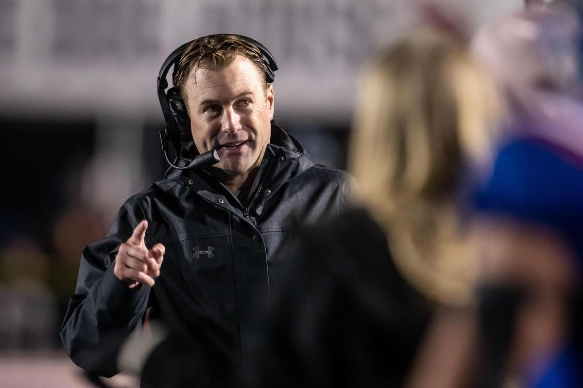 Folsom Bulldog head coach Paul Doherty smiles on the sideline during his team’s winning performance against Central Catholic of Modesto during the second half of the CIF Sac-Joaquin Section Division I high school football playoff semifinal game Friday, Nov. 18, 2022, at Folsom High School. Folsom beat Central Catholic, 62-27.