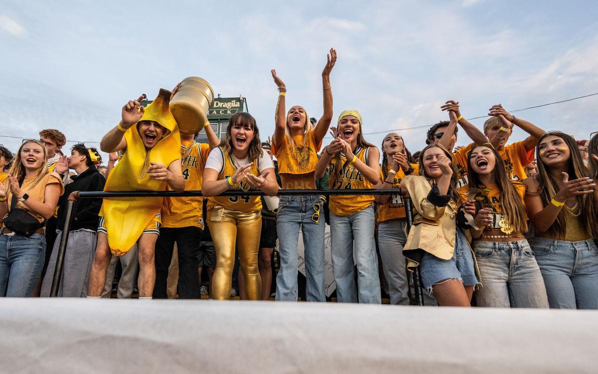 Placer High School students cheer on their team as they play against Casa Roble High School on Friday in Auburn during the season opener for both teams.